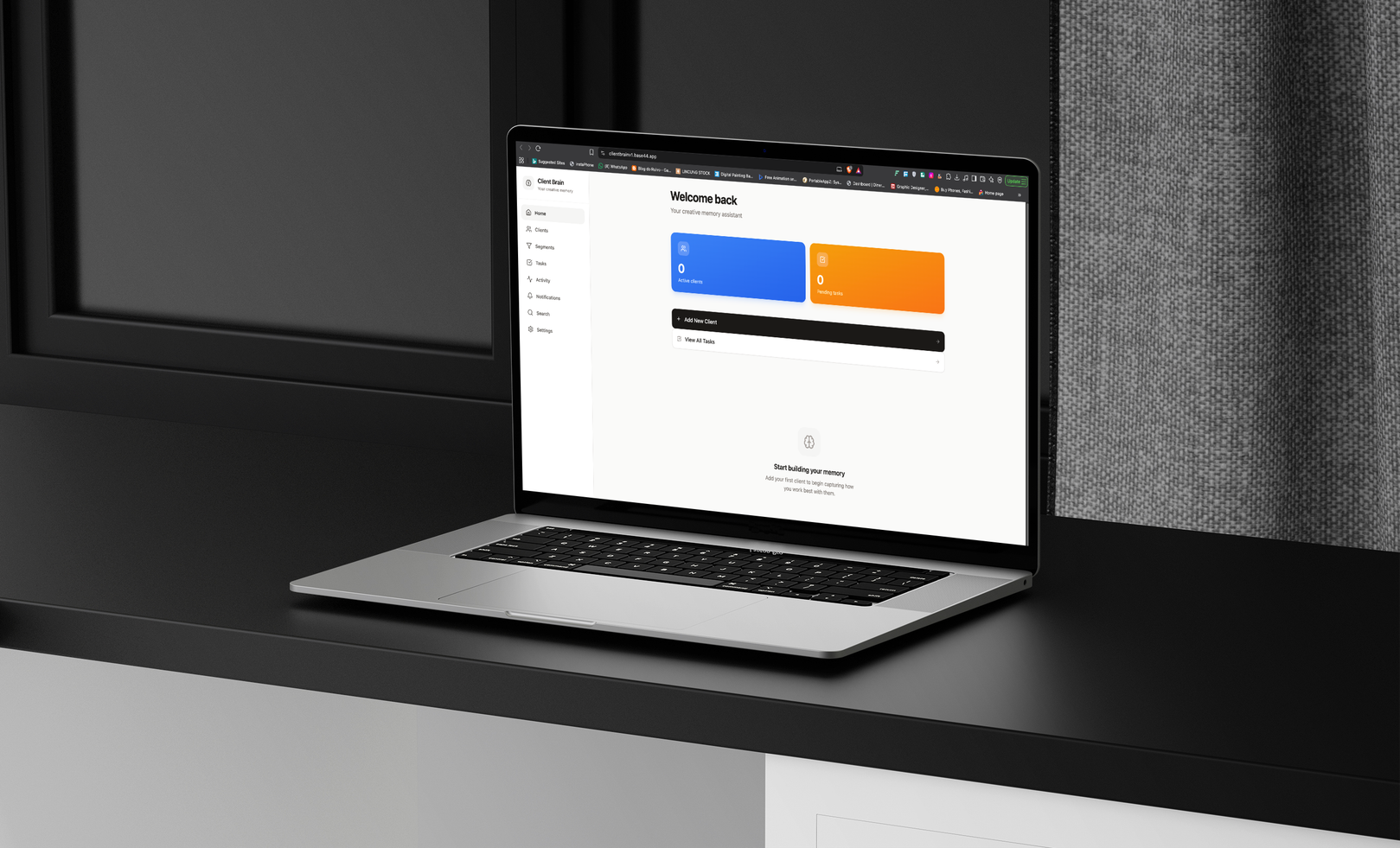 Client Brain web application dashboard on laptop desk